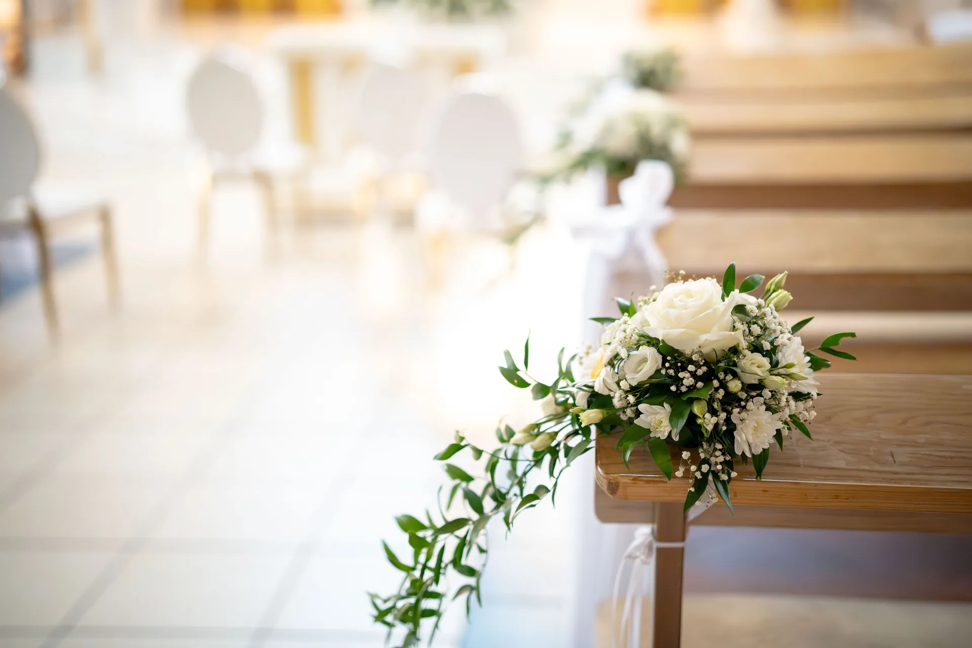 Wedding ceremony aisle lined with fresh flowers